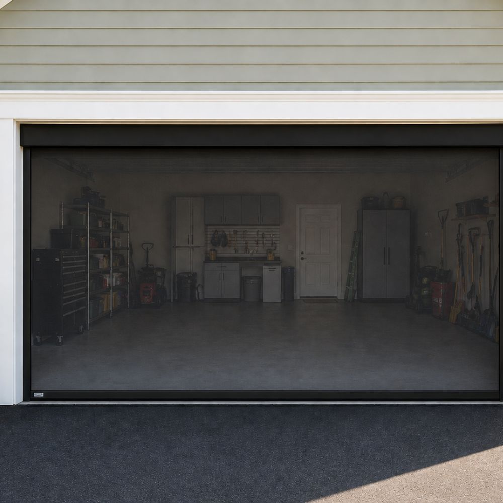 Motorized garage door screen installed on a residential garage for ventilation and insect protection